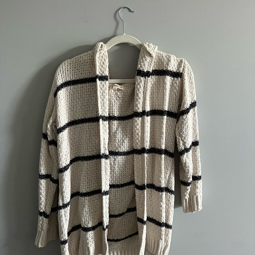 White and navy blue striped sweater.